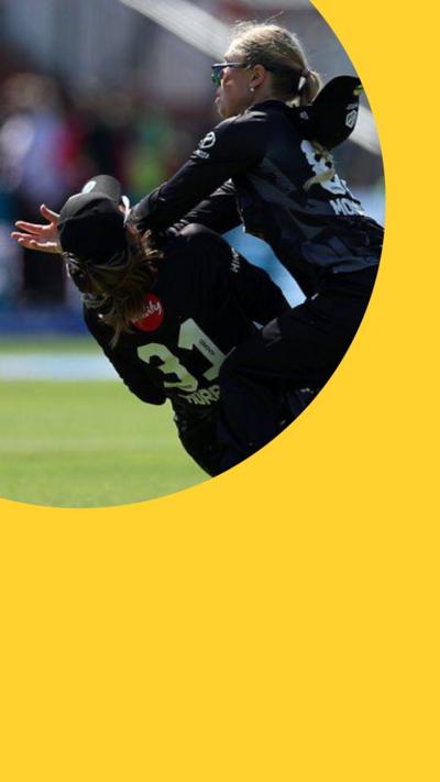 Two cricket players collide with each other on the pitch - one has her hands out
