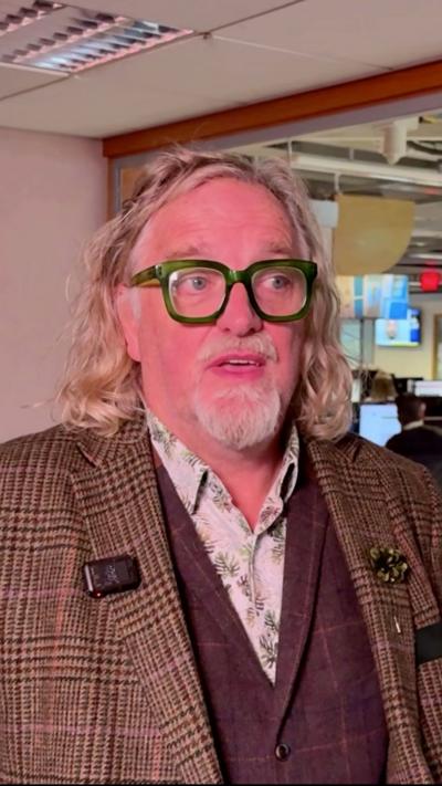 A man with glasses and a white goatee