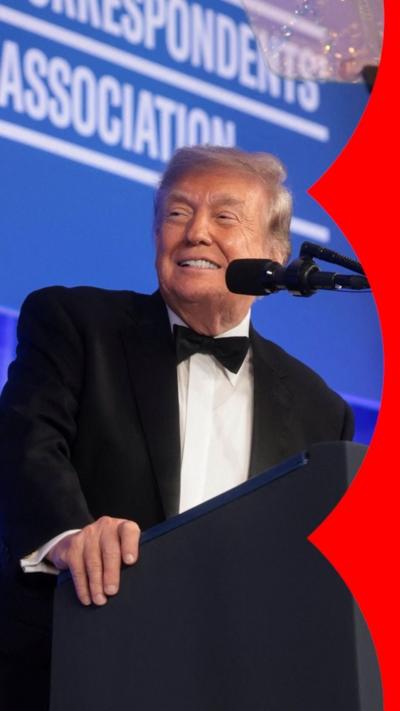 Donald Trump speaking on stage in a tuxedo