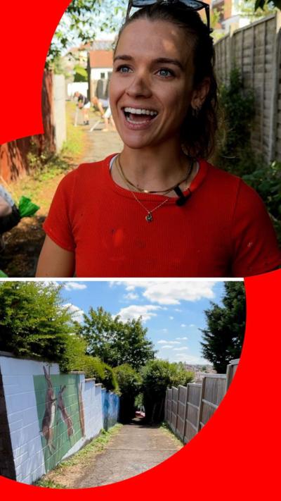 Woman smiles while people clean up alleyway in background