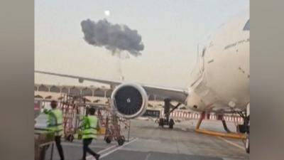 Smoke seen above planes at Dubai International Airport