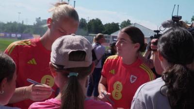 Sophie Ingle and Angharad James sign autographs