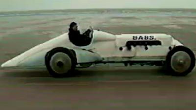 The rebuilt record-breaking car BABS being driven on Pendine Sands