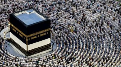 Muslim pilgrims pray around the Kaaba, Islam's holiest shrine
