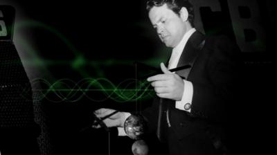 Photograph of Orson Welles in front of graphical sound waves