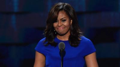 Michelle Obama standing behind microphone at 2016 DNC