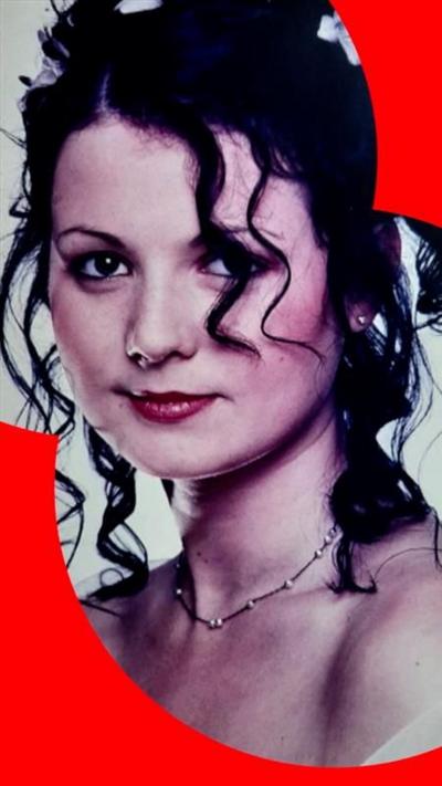 A woman, Jessica Laverack. She has long curly brown hair and wears a necklace