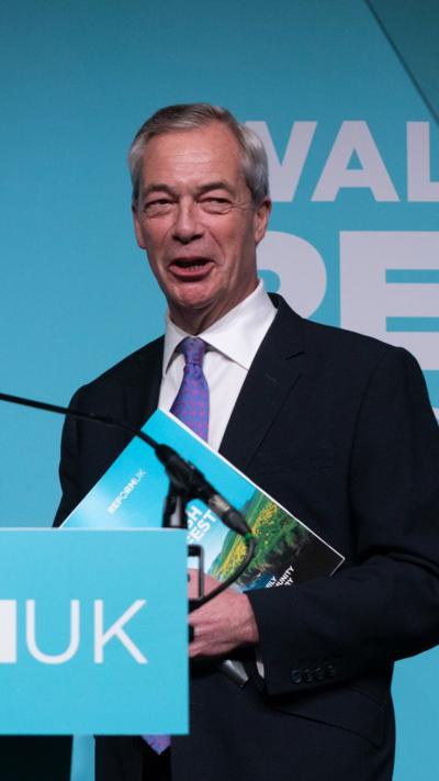 Nigel Farage with Reform manifesto