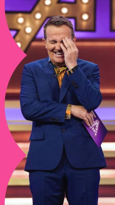 Bradley Walsh laughing with his head in his hand