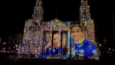 A light projection showing Rob Burrow and Kevin Sinfield