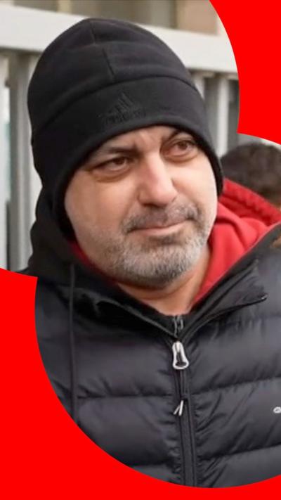 Man in black beanie hat and black puffer jacket