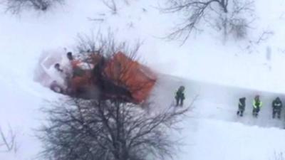 A still from aerial footage shows scores of emergency vehicles unable to reach the hotel