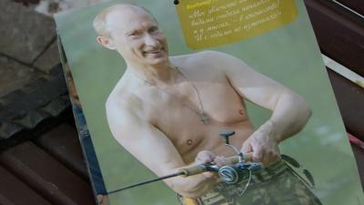 Putin, bare-chested holding his fishing rod - a calendar image