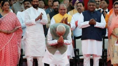 At a ceremony in Delhi, Narendra Modi is sworn in for a second term as India's prime minister.