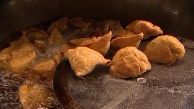 Samosas being cooked