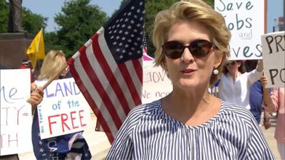 Woman at protest against stay-at-home orders