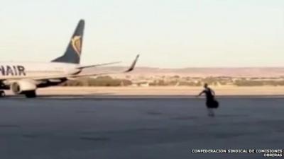 Man running on the tarmac