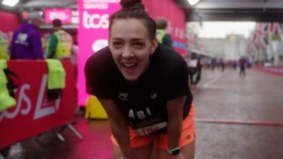 A runner at the finish line of the 2023 London Marathon