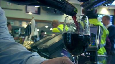 Glass of wine being poured