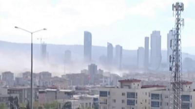 Smoke rising above buildings in Izmir