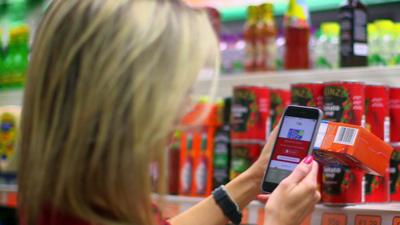 BBC Click's Lara Lewington uses a smartphone app in a supermarket