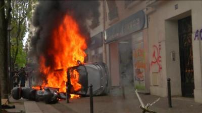 Overturned car burns in Paris