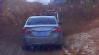 Car trapped in mud.