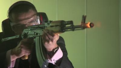 Officer with AK47 at National Ballistics Intelligence Service