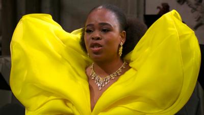 A woman singing at the King Charles Coronation