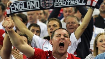 Fan shouts during English national anthem