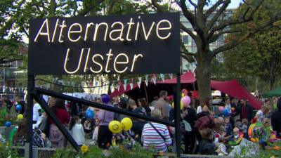 A sign reads Alternative Ulster at Belfast's Culture Night