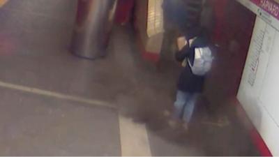 Commuter standing next to fallen panel at a subway station in Massachusetts