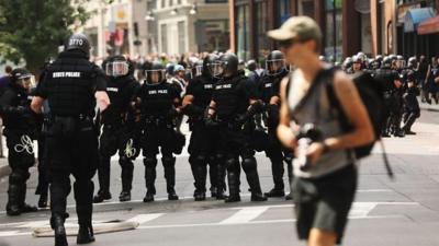 Police in Boston as protesters oppose a conservative rally, 19 August 2017