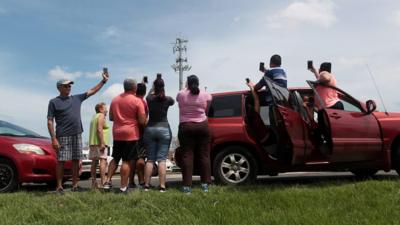 People are hunting for phone signals so they can finally reassure friends and family they are safe.