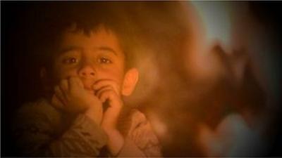 small boy in refugee camp