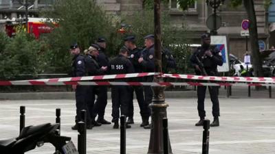 Officers outside police headquarters in Paris