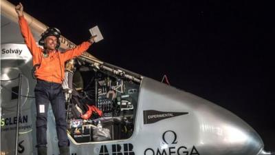 Pilot celebrating the solar impulse landing