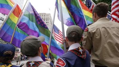 Cub Scouts and Boy Scouts prepare to lead marchers while waving flags at the 41st annual Pride Parade Sunday, June 28, 2015, in Seattle