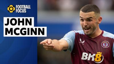 John McGinn points at something