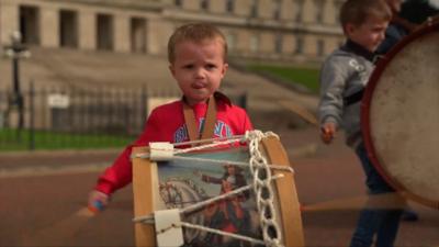 Boy plays Lambeg drum