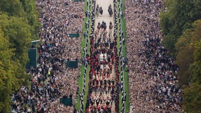 The Ceremonial Procession of the coffin of Queen Elizabeth II travels down the Long Walk