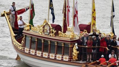 The Royal Barge Gloriana leads a procession along the River Thames to pay tribute to Queen Elizabeth becoming Britain's longest-reigning monarch