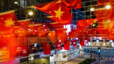 Flags of China and Hong Kong above a street