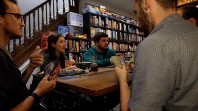 A group of people playing a board game