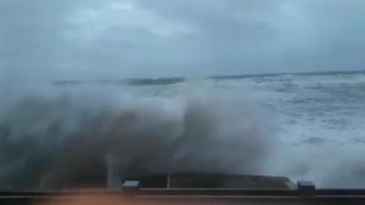 Waves hit a train at Llanbedr