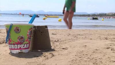 Beach with bucket and spade