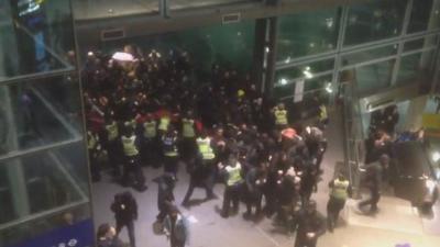 Police clash with protestors at St Pancras Station