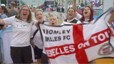 Women celebrating the football in London