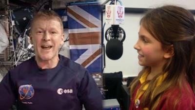 Tim Peake and school child