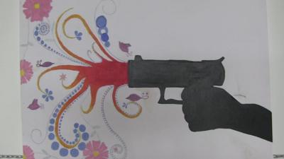 Painting of gun shooting flowers